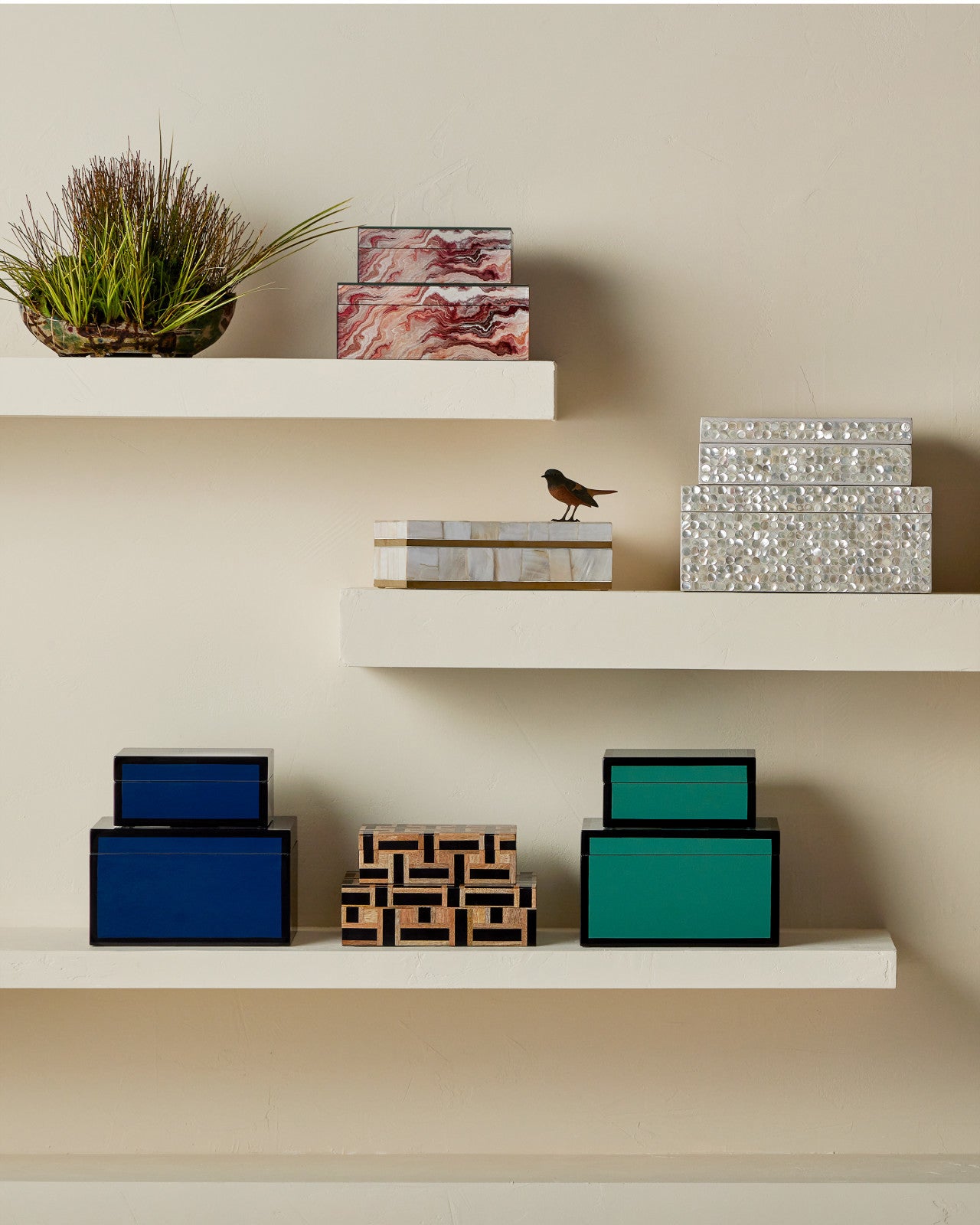 Gerri Dot Set of 2 by Currey and Company displayed on shelves with other decorative boxes, illustrating its elegant design.