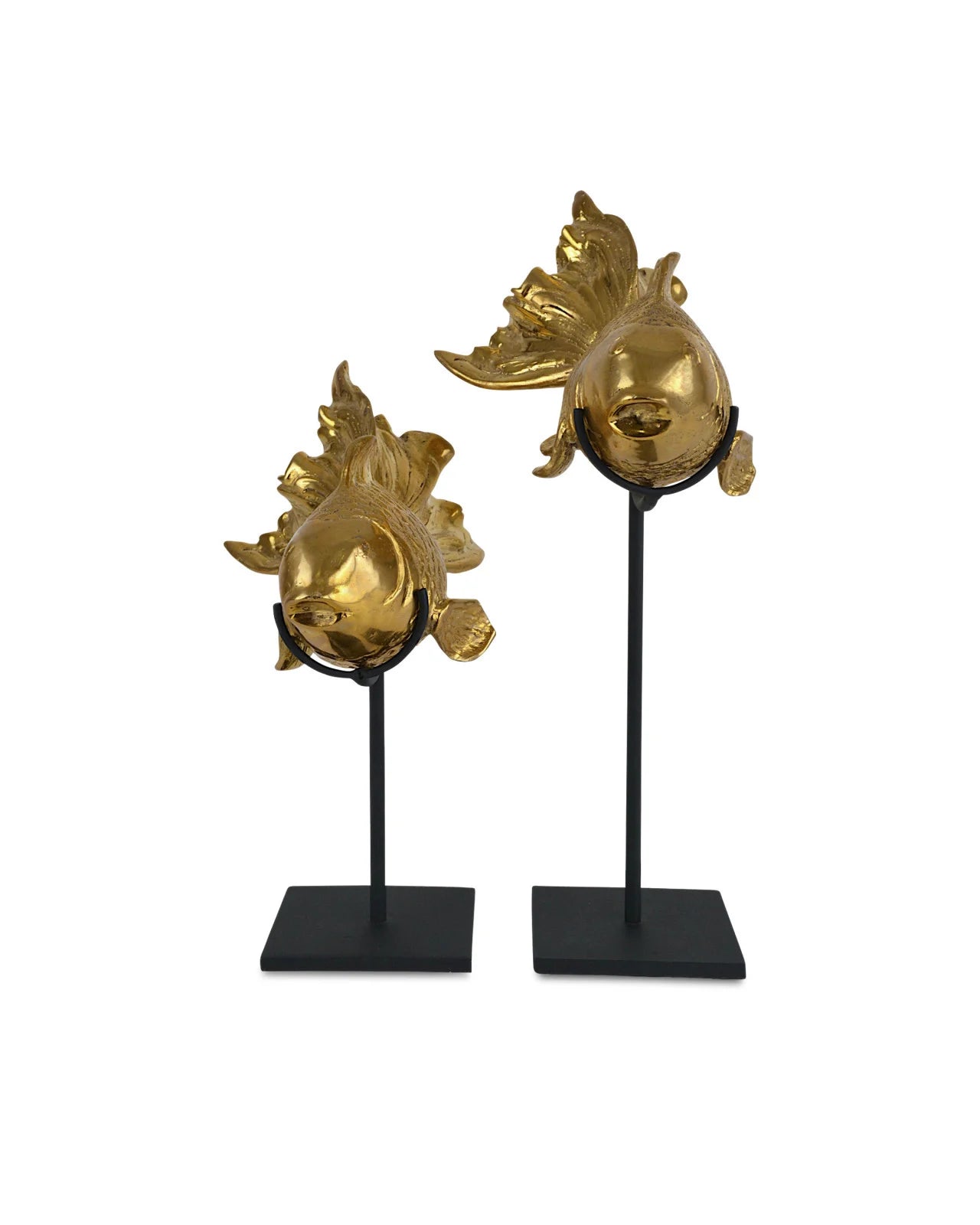 Goldfish Set of 2 by Currey and Company elegantly placed on a wooden dresser under a contemporary light fixture, enhancing a chic and sophisticated room decor.