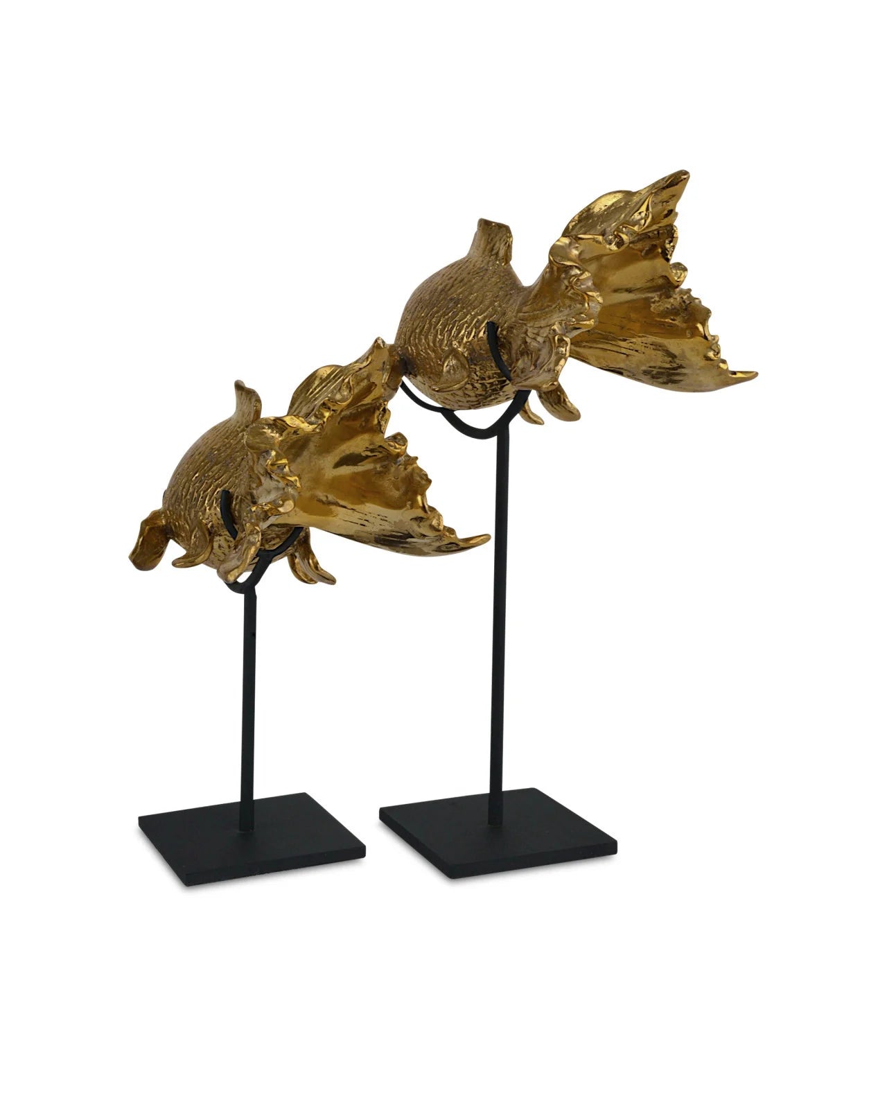 Goldfish sculpture from the Goldfish Set of 2 by Currey and Company, positioned atop a decorative box in a styled setting, demonstrating the versatility and decorative appeal of the sculptures in home decor.