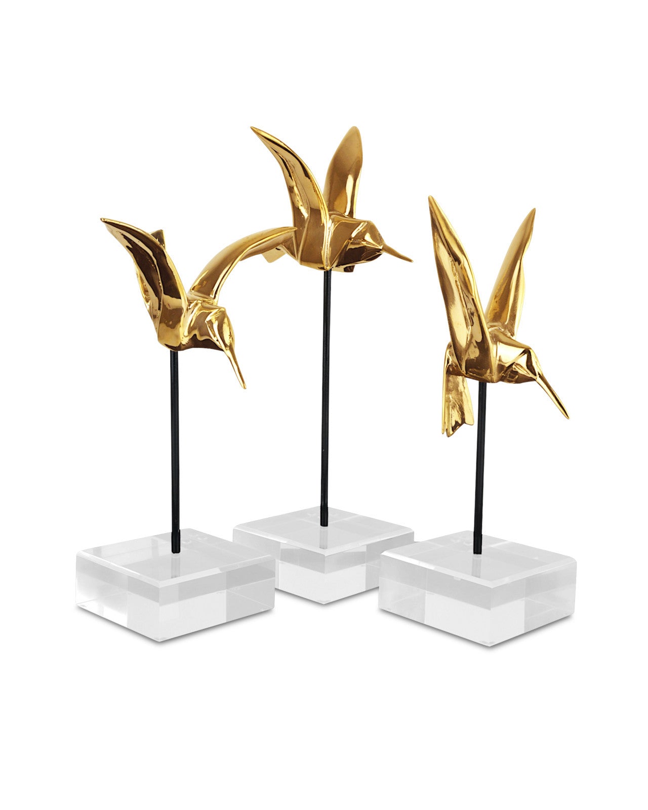 Gold Hummingbirds Set of Sculptures by Currey and Company displayed on a tabletop, illustrating their elegant design and hovering effect.