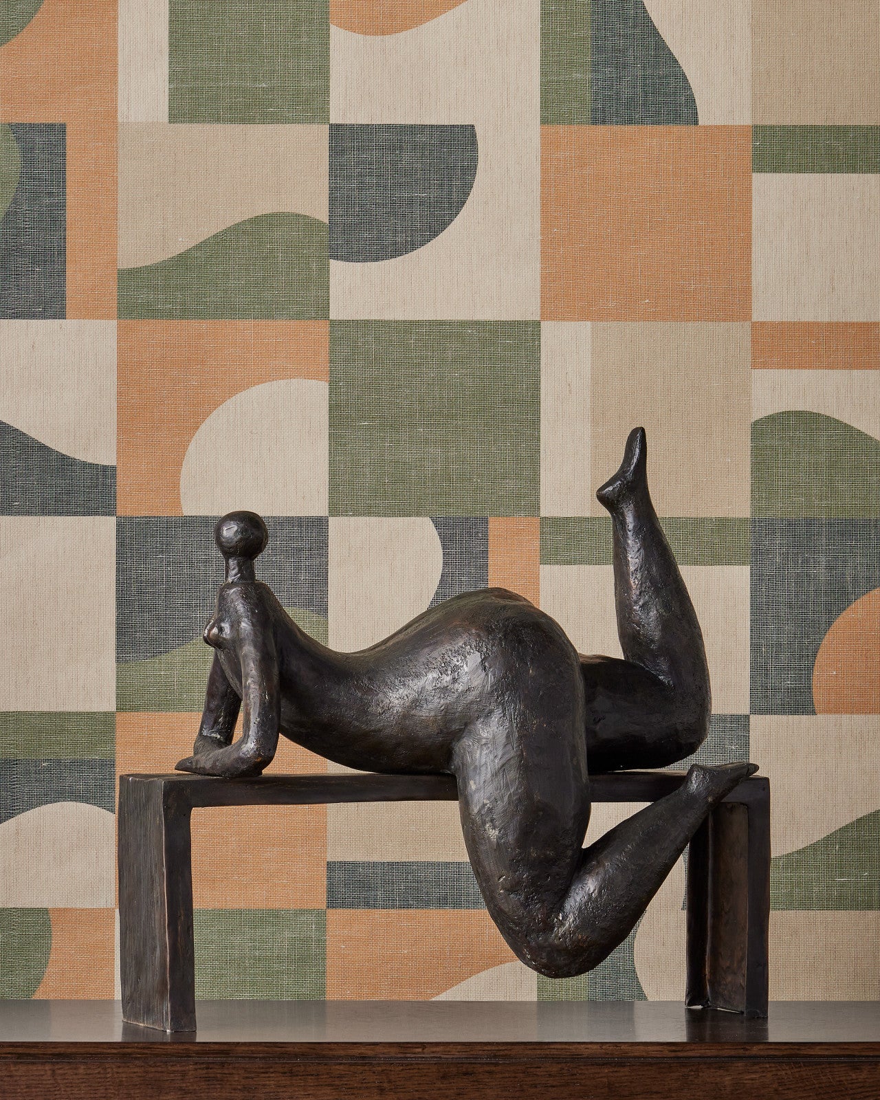 Odalisque Bronze sculpture by Currey and Company displayed in a modern interior, illustrating its sophisticated aesthetic and decorative appeal.