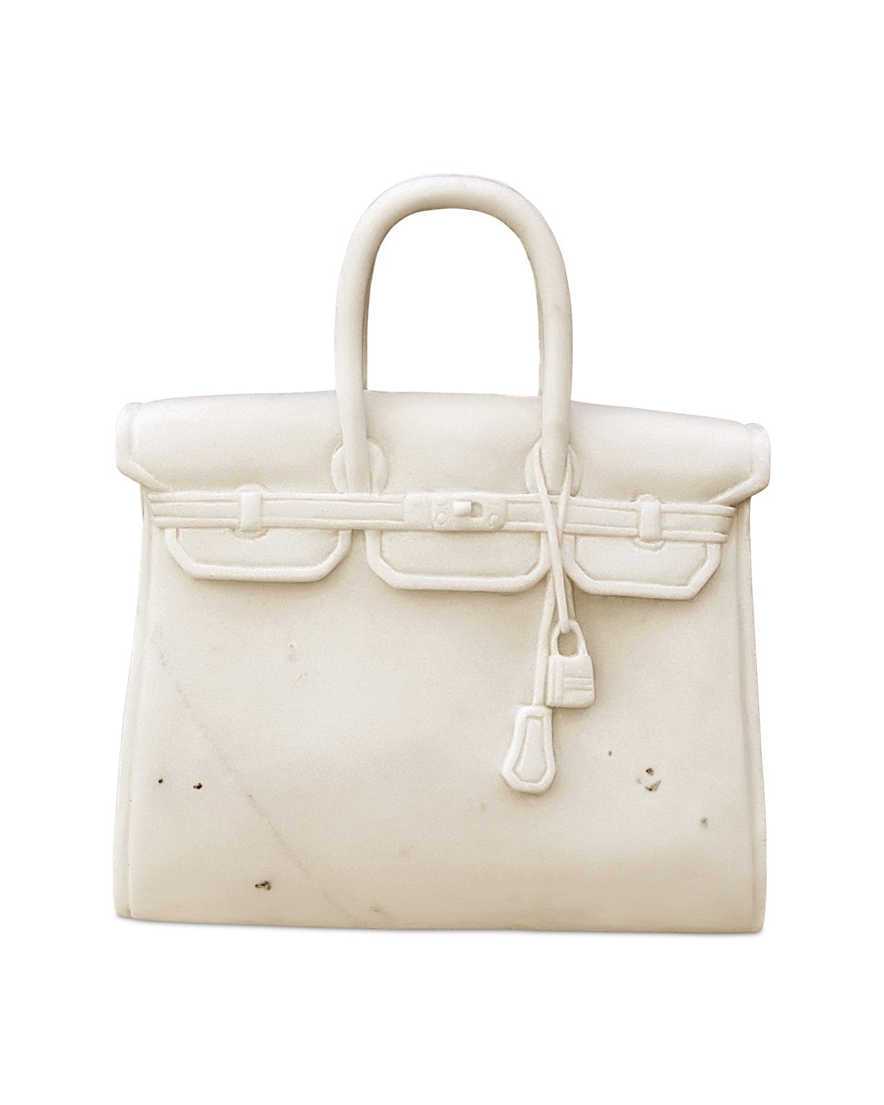 Image showcasing the exquisite marble detailing of The Princess by Currey and Company, available at ChicHomeVibes.com. This close-up view reveals the variations in color and intricate details of the white marble used to sculpt this replica Hermes Birkin Bag. The rich textures and luxurious finish emphasize the craftsmanship, making this marble sculpture a magnificent tribute to the iconic Hermes Birkin, ideal for discerning home decor enthusiasts.